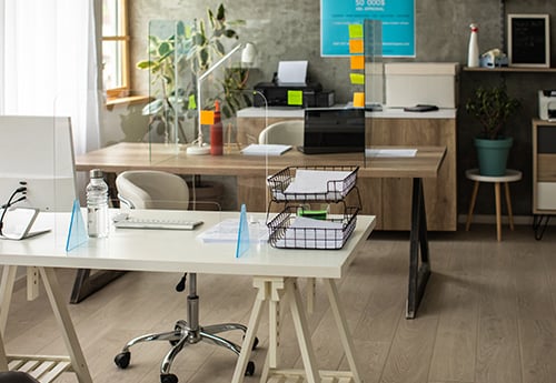 empty desks in an open concept office space